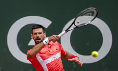 Serbia's Novak Djokovic returns a ball to Hungary's Marton Fucsovics during their match at the ATP 250 Geneva Open tennis tournament in Geneva on May 21, 2025. (Photo by FABRICE COFFRINI / AFP)