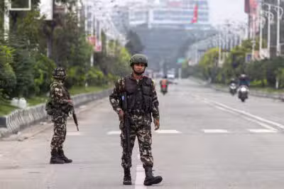 Army personnel patrol a street as part of security measures imposed in Kathmandu on September 10, 2025. Nepali demonstrators set parliament ablaze on September 9, while the veteran prime minister quit, as a 