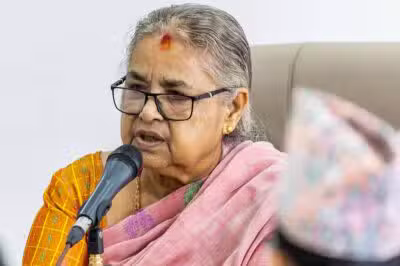 Newly-elected Prime Minister of Nepal's interim government Sushila Karki speaks with officials at the prime minister's office in Kathmandu on September 14, 2025. Nepal's new leader vowed on September 14 to follow protesters' demands to