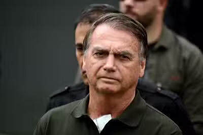 Former Brazilian President (2019-2022) Jair Bolsonaro leaves the DF Star hospital in Brasilia on September 14, 2025, after undergoing a series of medical examinations, as he remains under house arrest. Brazil's Supreme Court on September 11 sentenced firebrand ex-president Jair Bolsonaro to 27 years in prison for coup plotting at the end of a landmark trial that divided the nation and drew US fury. (Photo by Pablo PORCIUNCULA / AFP)